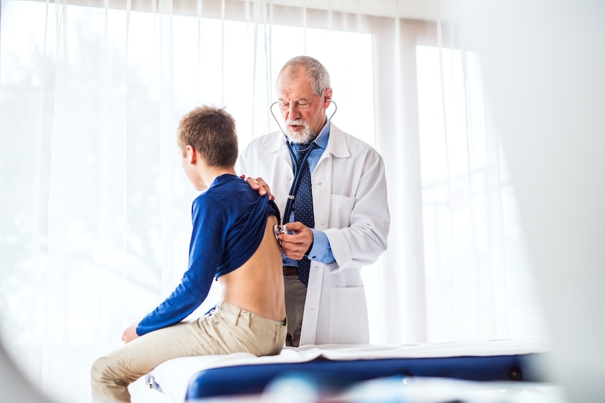 Provider conducting a pre-participation sports physical exam at Southside Medical & Laser Center