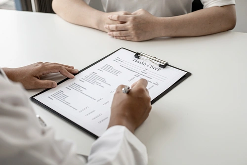 A doctor and patient discuss results from a yearly physical exam.